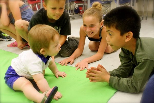 babies and kids playing