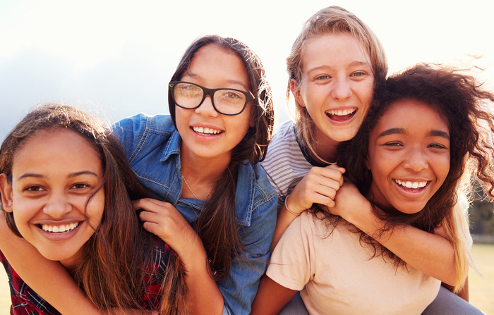 four girls laughing