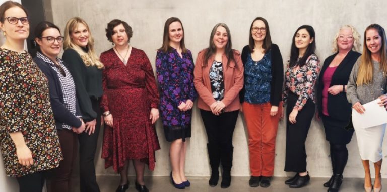 All 10 Women of Distinction 2020 nominees standing against wall