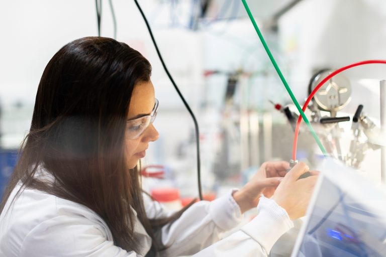 girl with safety goggles working in STEM