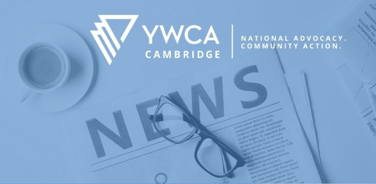 Blue filter over image of a folded newspaper with glasses sitting on top. Cup of coffee top left. YWCA Cambridge logo top centre.