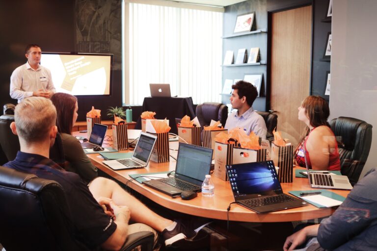 business-team-having-a-meeting-in-their-office-at-a-large-table