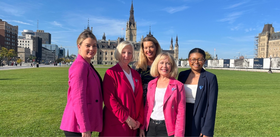 the YWCA team stands on Parliament Hill.