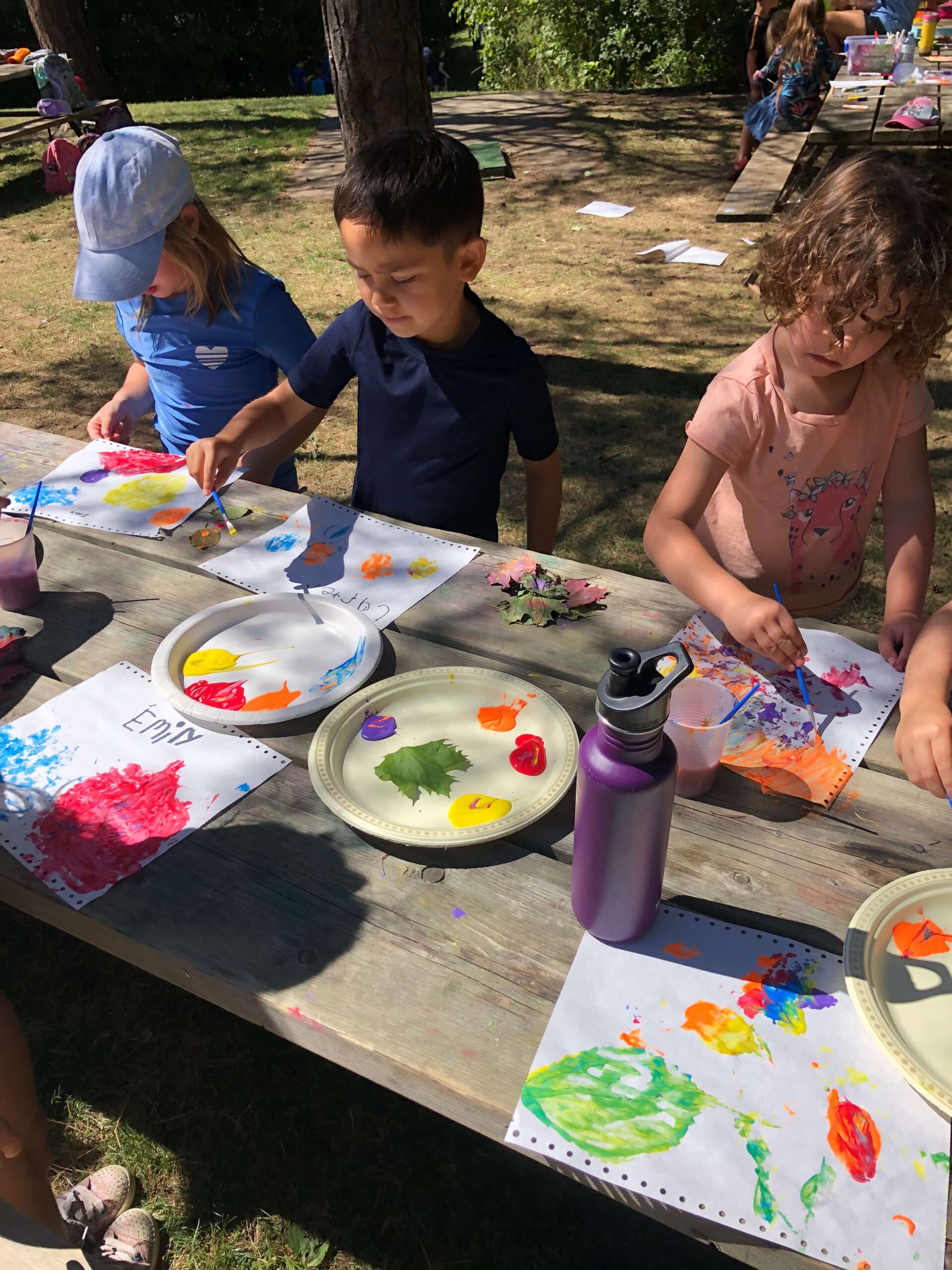 shades mills campers painting and crafting on a pic nic table