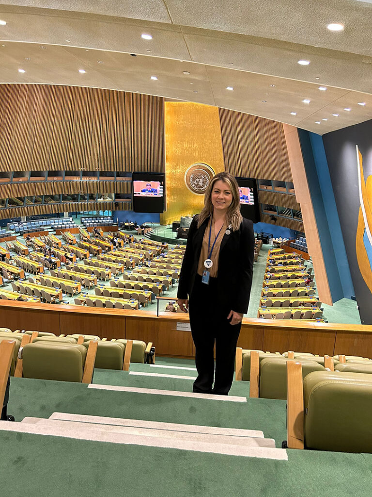 Roz stands in the UN General Assembly