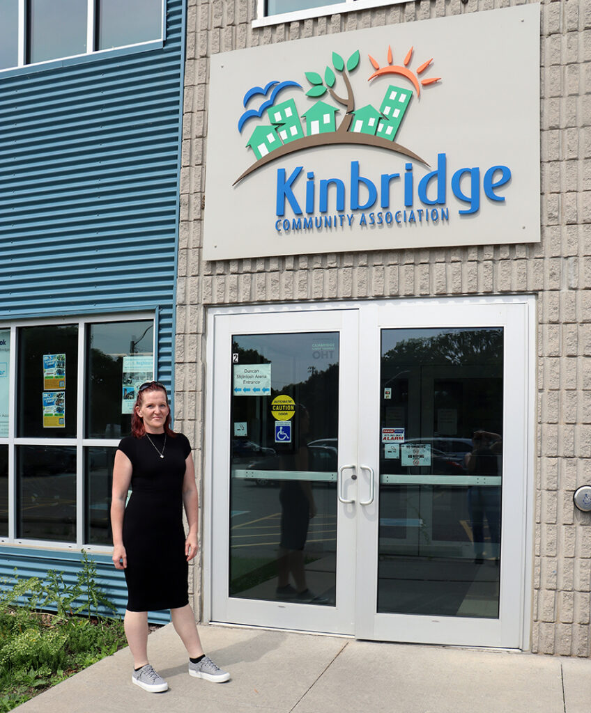 Nikki stands outside of the Kinbridge office on Christopher street.