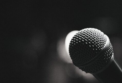Black and white photo of a microphone close up