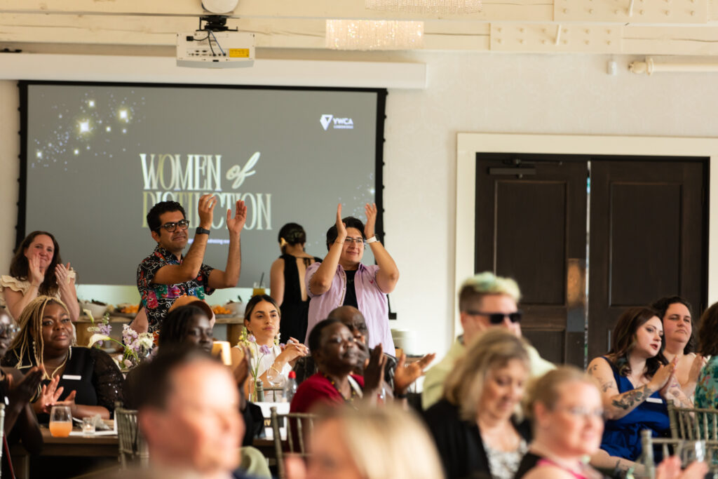 Photo of the audience at WOD 2025 cheering for a WOD recipient