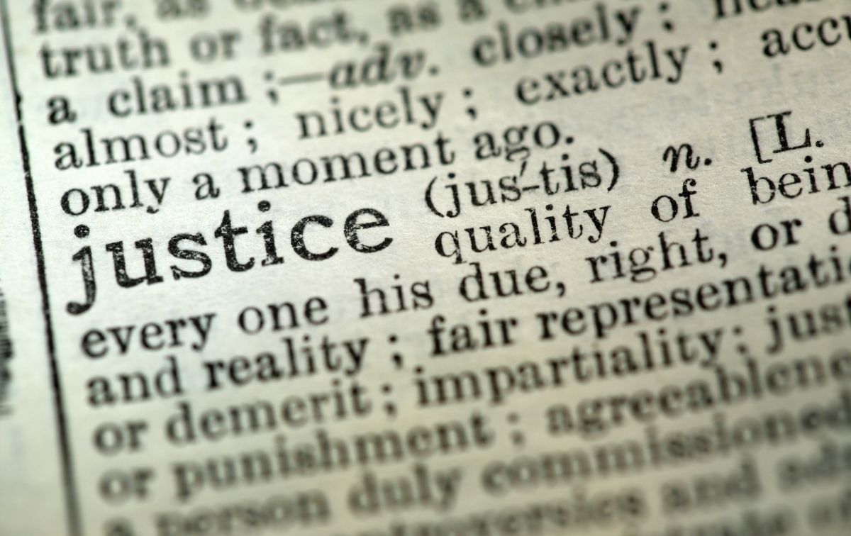 Close-up of the dictionary definition of "justice"