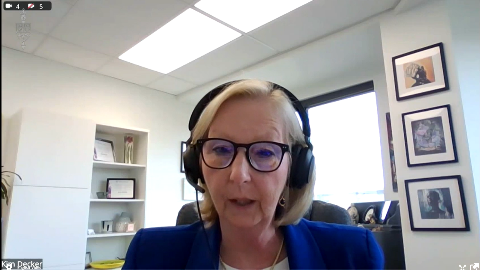 Screenshot of Kim Decker speaking on a virtual meeting.