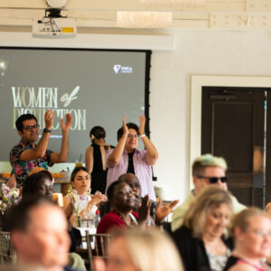 a group of people celebrating award winners at the women of distinction event