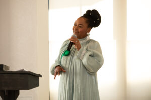 a woman speaks into the microphone