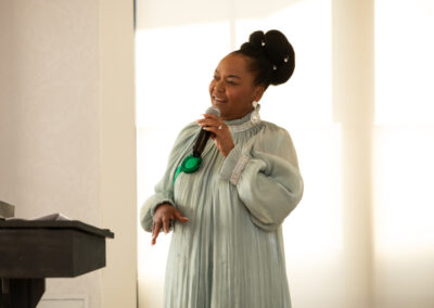 a woman speaks into the microphone