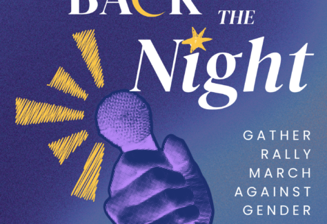 a hand holding up a microphone with nighttime colours
