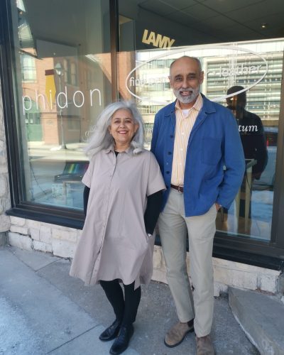 Owners of Phidon pens standing in front of their storefront